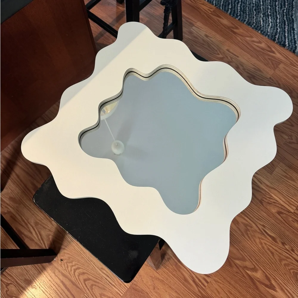Small wavy cut mirror. Cream color. Like new.